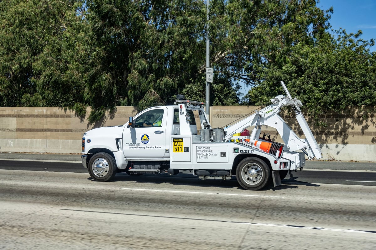 Metro tow truck helping motorists